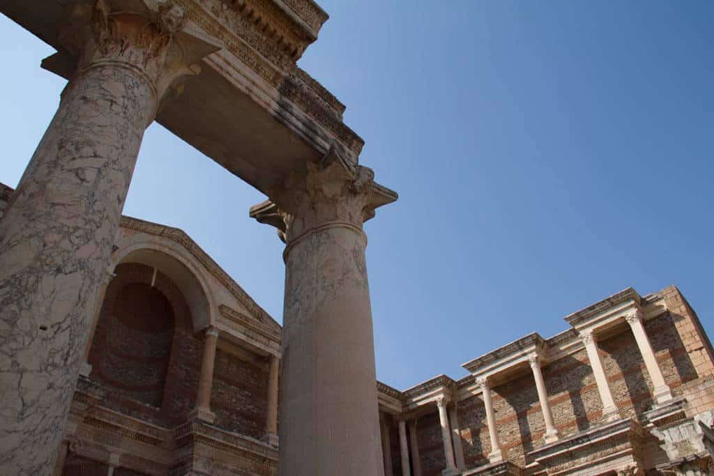 A view of marble columns and the façade, part of an ancient gymnasium in Sardis. A gymnasium was roughly equivalent to a high school, but with a strong emphasis on preparation for public athletic games (hence the modern use of the word “gymnasium”).