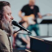 Worship pastor leading a new song