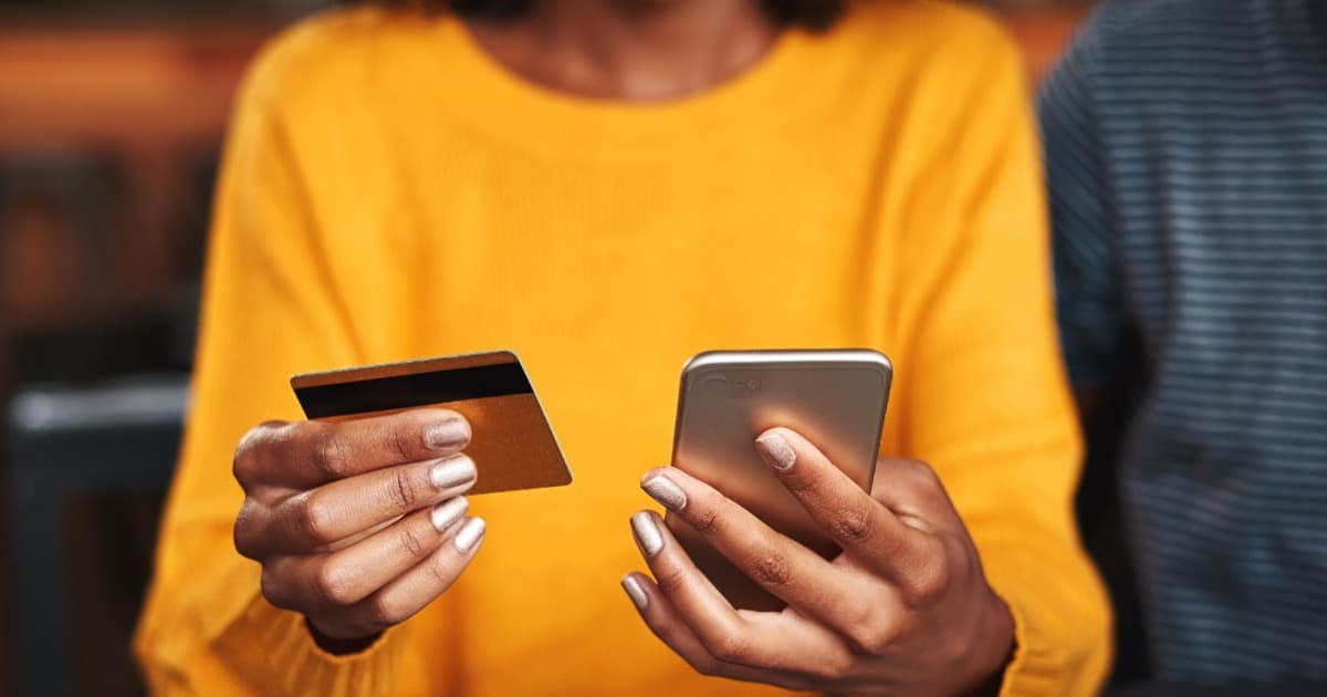 woman using phone for online giving on her church's website