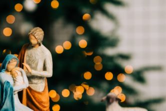 woodwork nativity scene, header for Christian Christmas songs post
