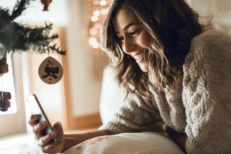 woman looking at a church's social media at Christmas